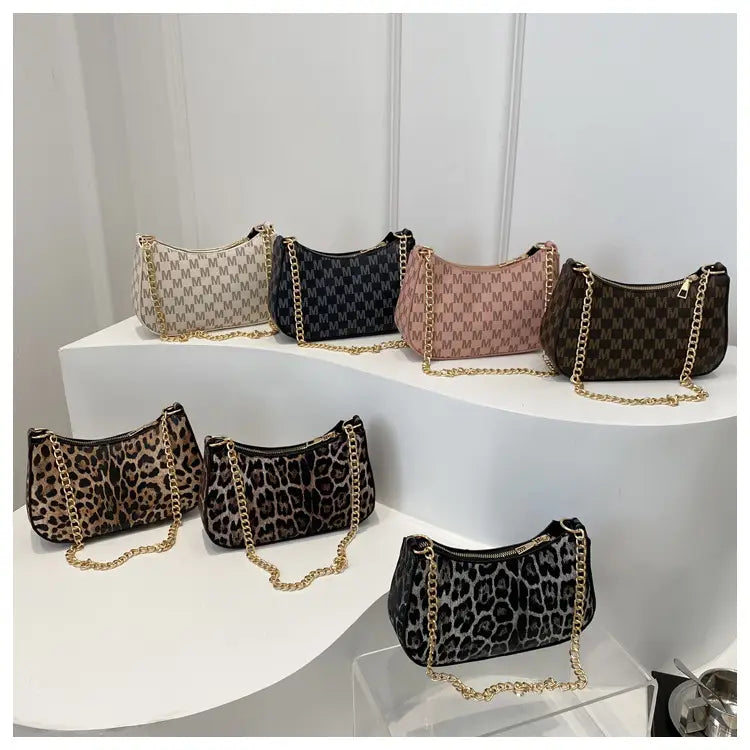 Leopard print bag held by model